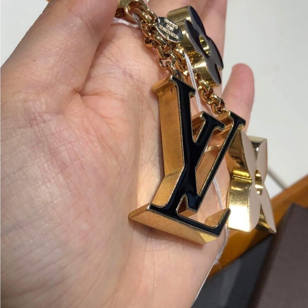 LV Charm $300 with box and dustbag